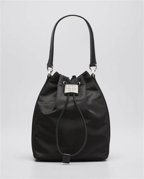 givenchy bucket bag street style|Givenchy iconic black pouch.